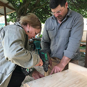 Mayor Carol Sparks is assisted by Tenterfield based nest box builder Paul Hughes. c. Landcare NSW