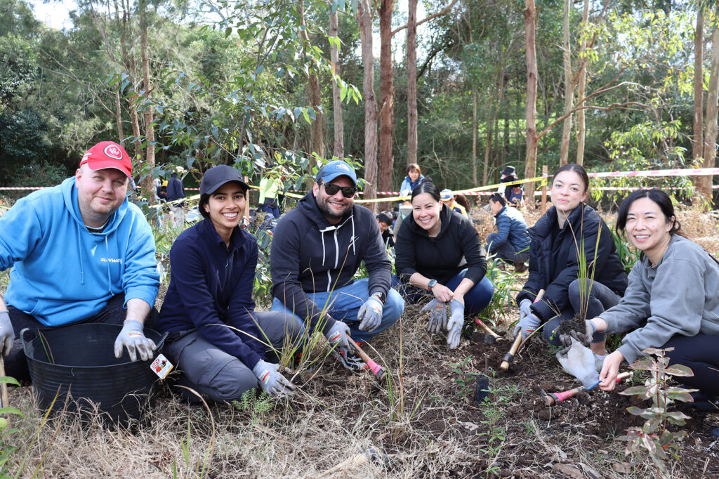 5_VolunteersPlantingWithGSLCreatingCanopiesJuly2022